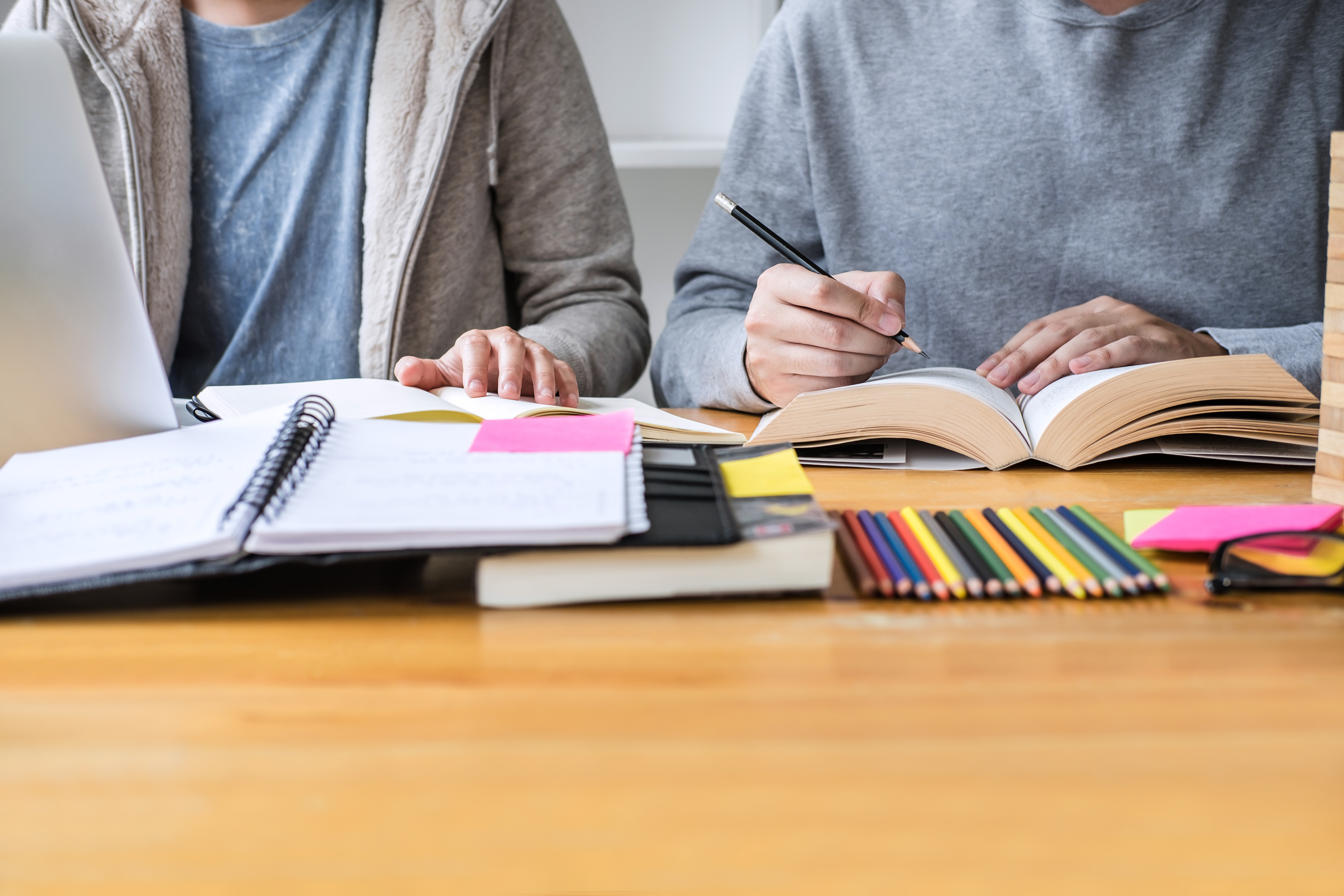 Education, Teaching, Learning Concept. High School Students Or Classmates Group Tutor In Library